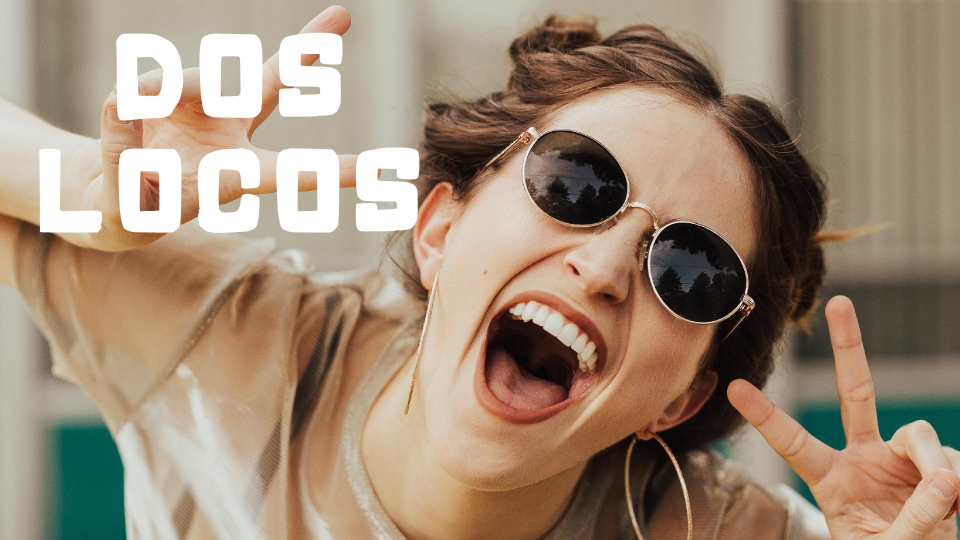 Dos Locos wordmark with a female showing peace signs